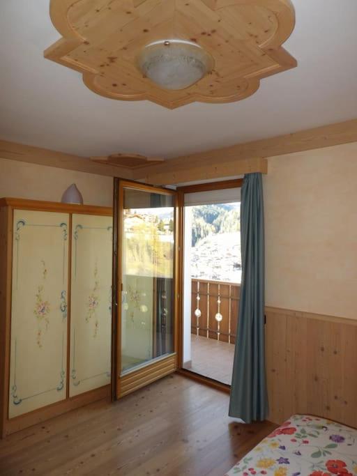 Postel nebo postele na pokoji v ubytování Ciasa Gran Panorama Moena