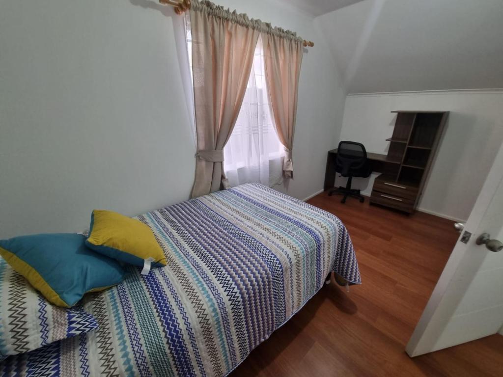 Postel nebo postele na pokoji v ubytování Casa Frutillar Alto