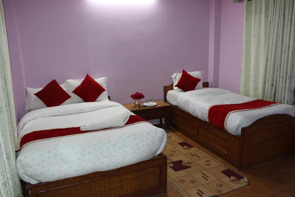 Rúm í herbergi á Hotel Snow Leopard