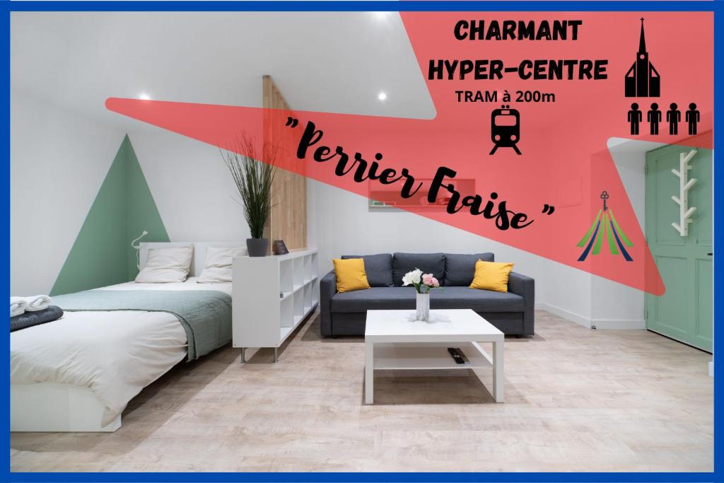 a living room with a bed and a couch at ※Perrier Fraise※ Coeur de ville ⁕ Appt d'exception in Clermont-Ferrand