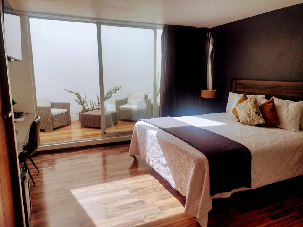 Postel nebo postele na pokoji v ubytování Hotel CLARUM 101