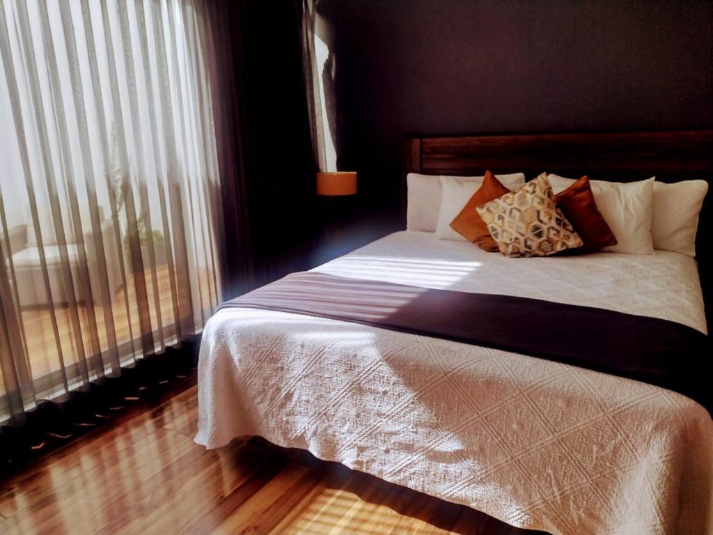Postel nebo postele na pokoji v ubytování Hotel CLARUM 101