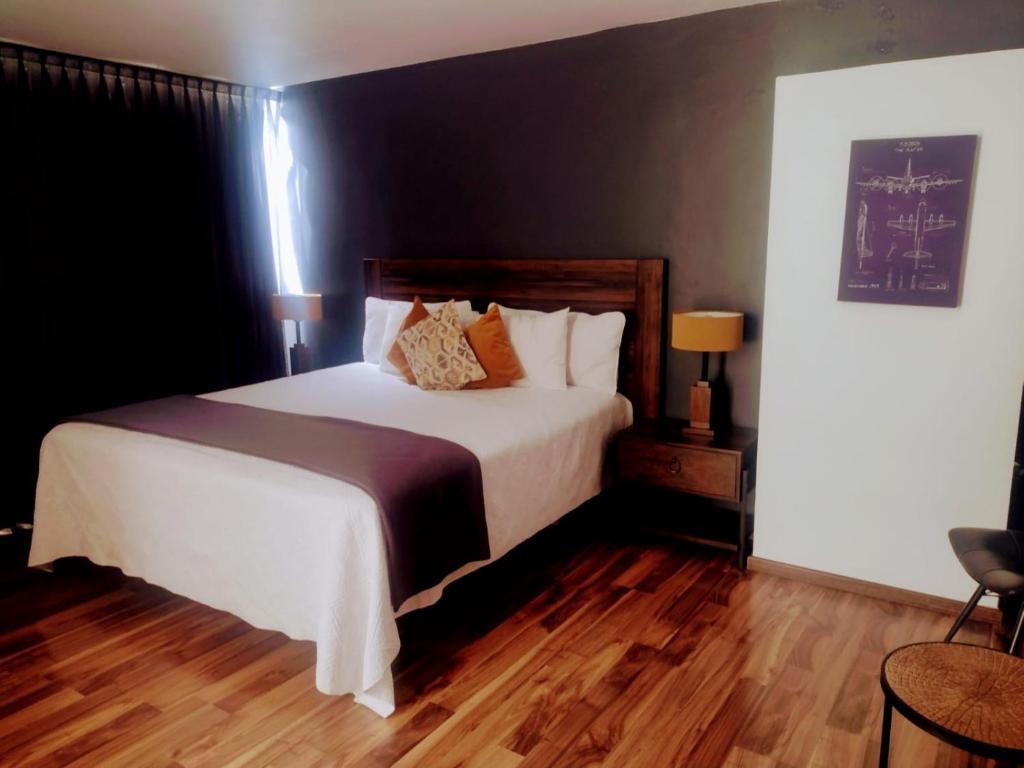 Postel nebo postele na pokoji v ubytování Hotel CLARUM 101