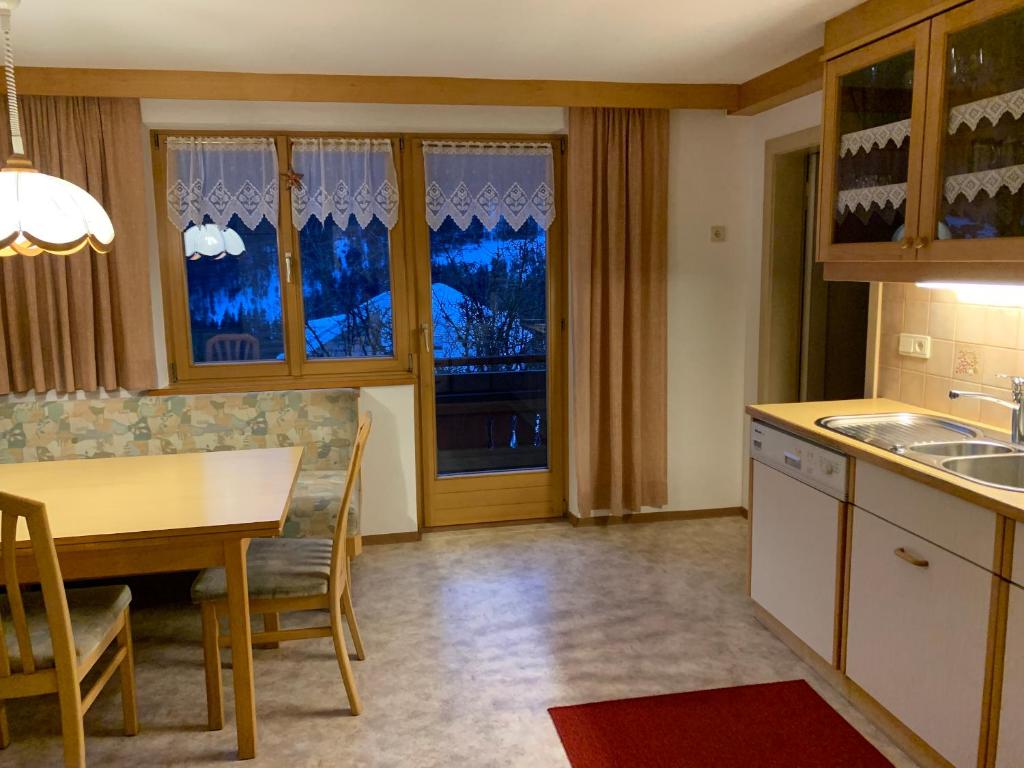 Kuchyň nebo kuchyňský kout v ubytování Alba Apartments