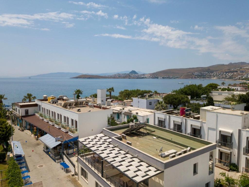 an aerial view of buildings and a body of water at Naz Liman Otel Bodrum in Bodrum City