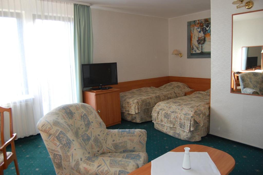 TV a/nebo společenská místnost v ubytování Hotel Wodnik