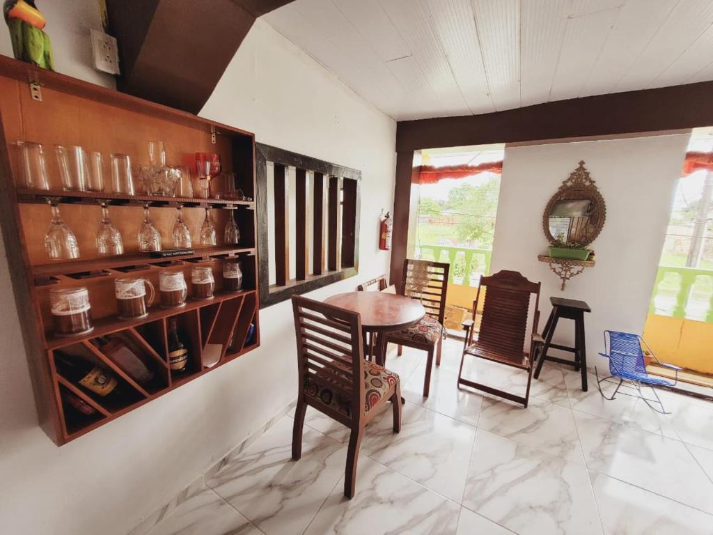 a dining room with a table and chairs at Divino Niño Hotel in Leticia