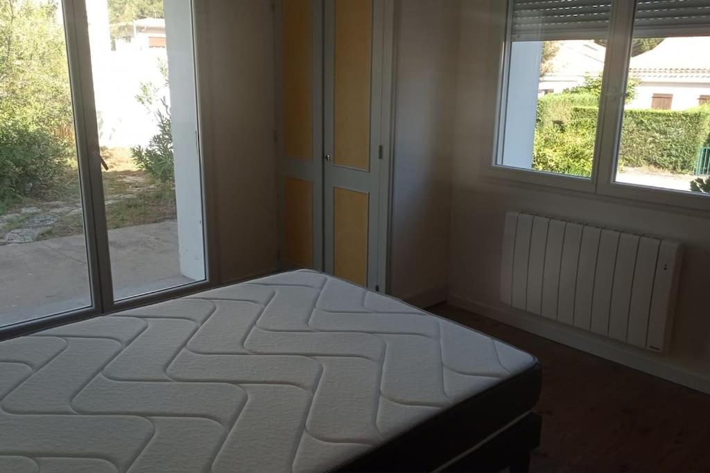 Postel nebo postele na pokoji v ubytování 400m de la plage Maison 3 chambres avec jardin