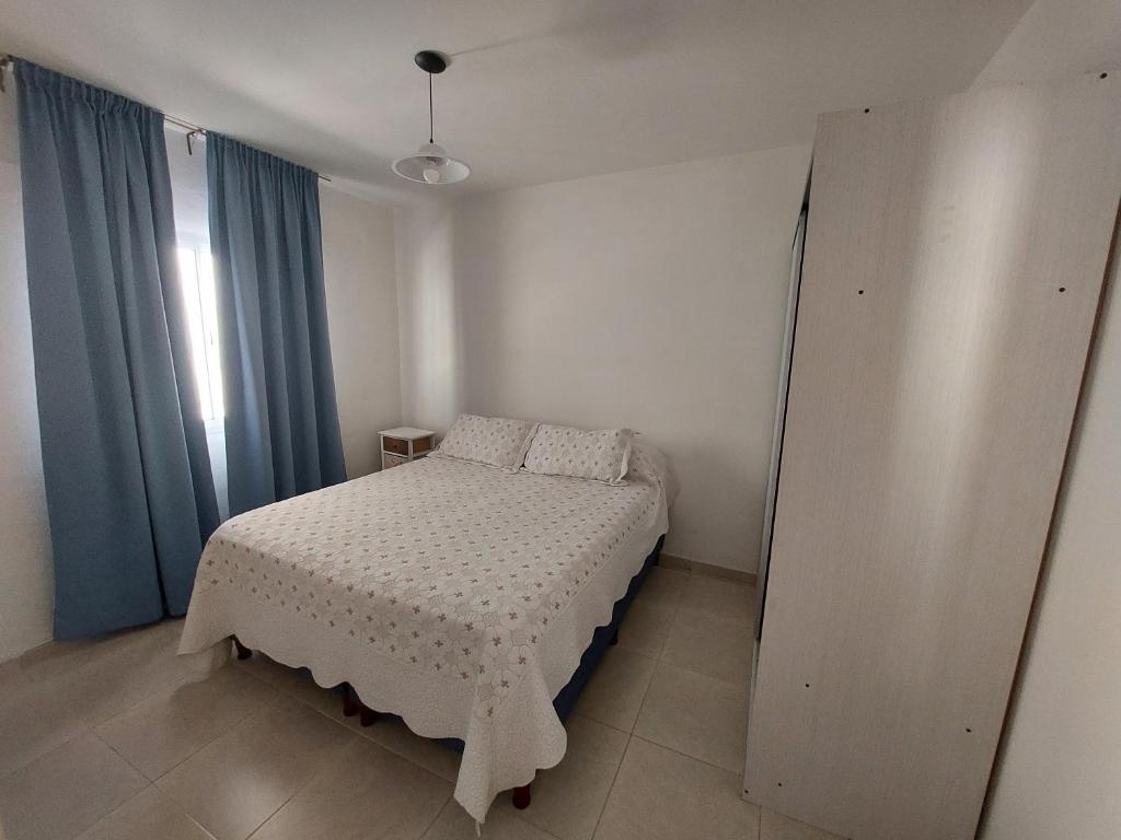 Ένα ή περισσότερα κρεβάτια σε δωμάτιο στο Departamento centro