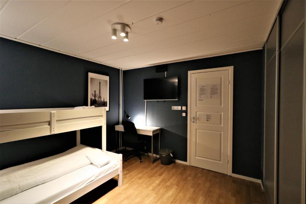 Postel nebo postele na pokoji v ubytování RIBO Apartment Arctic