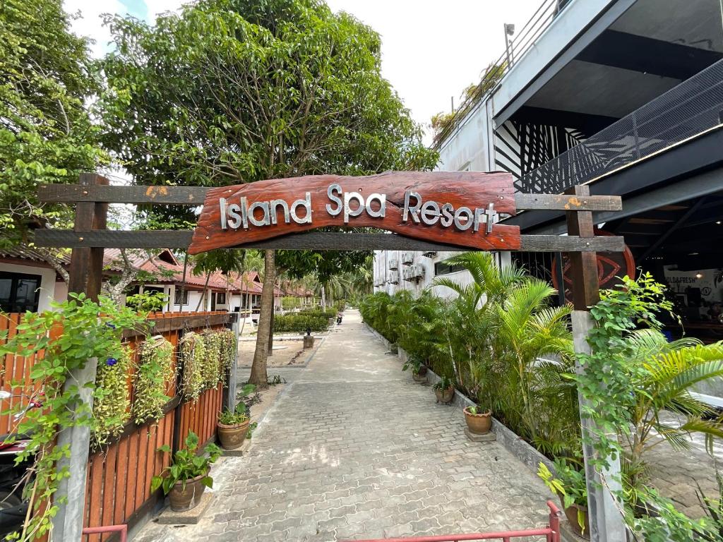 a sign that reads island sopa resort on a walkway at Island Spa Resort in Koh Tao