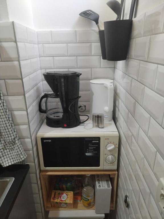 Kuchyňa alebo kuchynka v ubytovaní Apartment Vespa & Jacuzzi