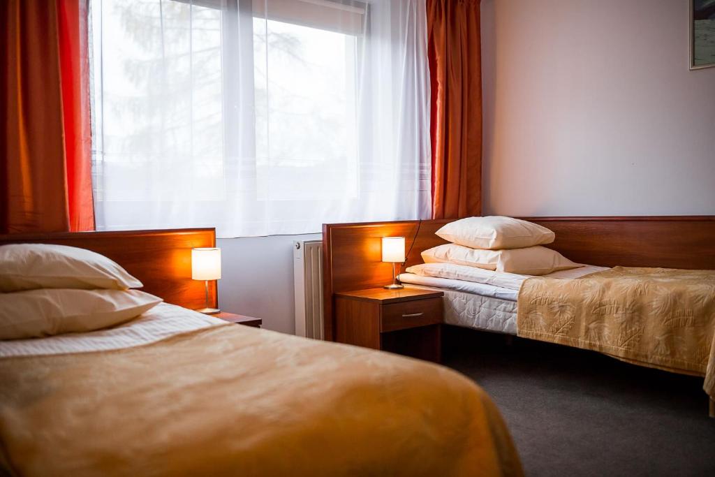 Postel nebo postele na pokoji v ubytování Wołosań B&B