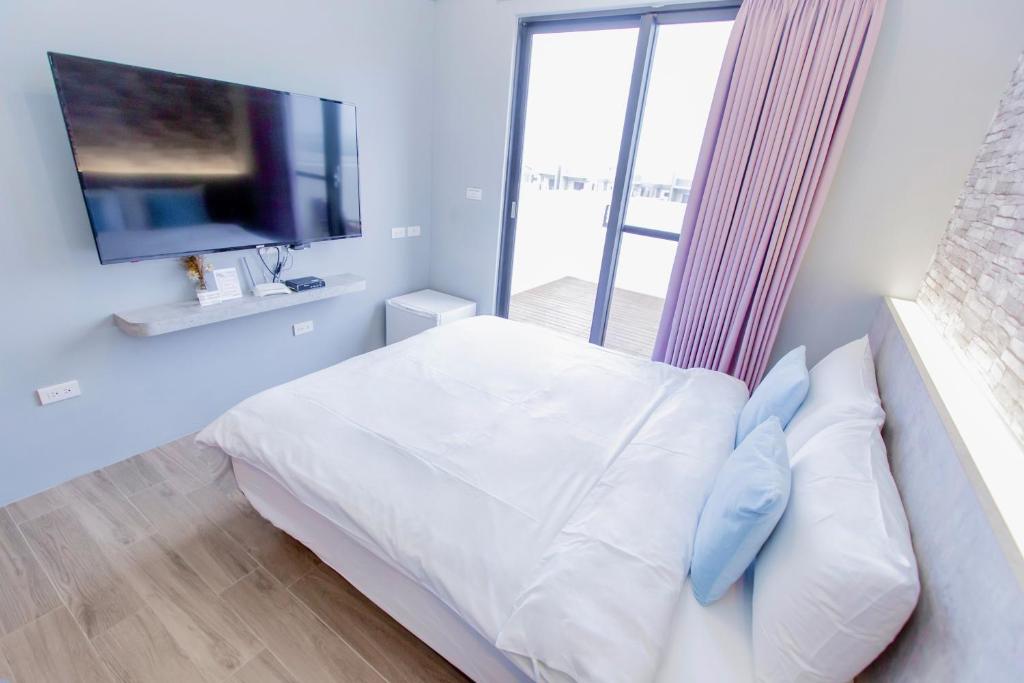 Postel nebo postele na pokoji v ubytování Huayu Homestay