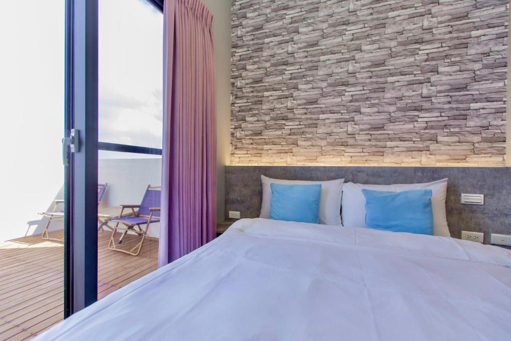 Postel nebo postele na pokoji v ubytování Huayu Homestay