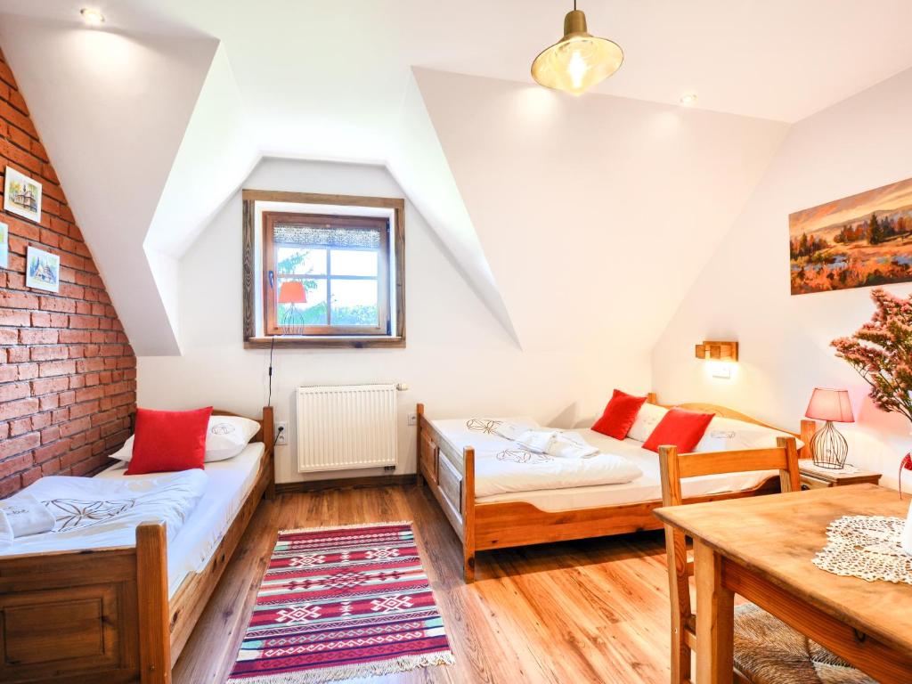 Postel nebo postele na pokoji v ubytování Gościniec Rabe - Agro&SPA