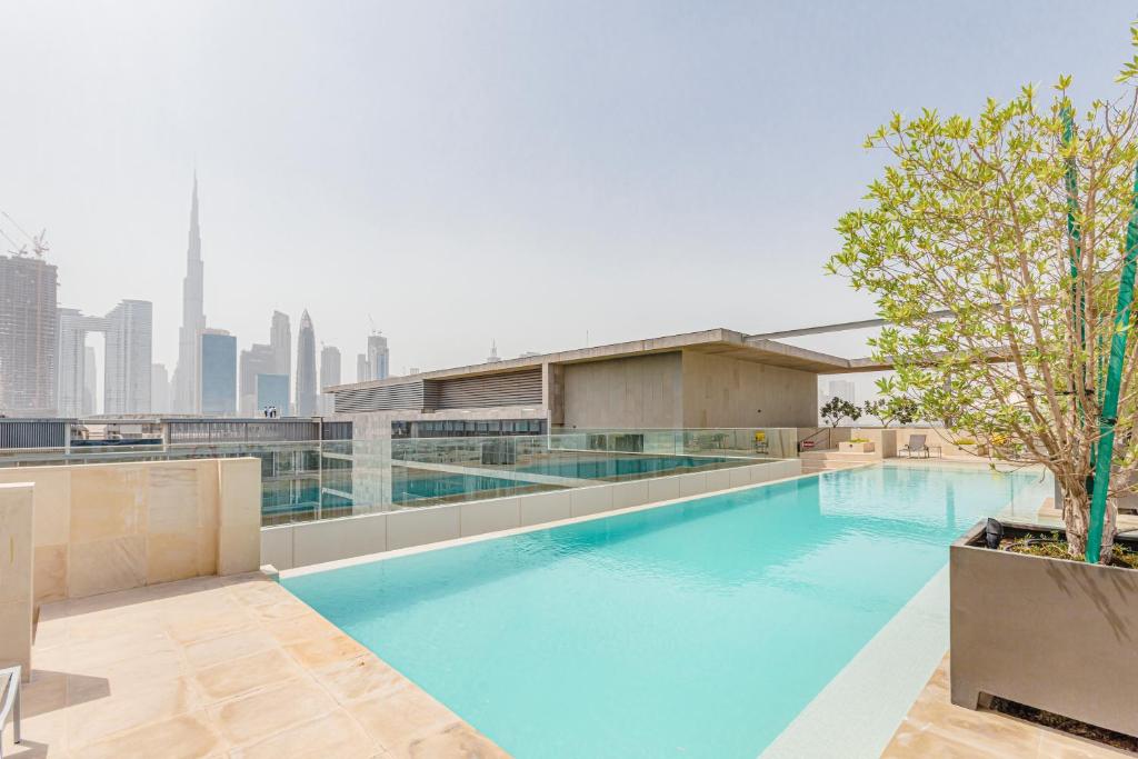 a swimming pool on the roof of a building at Vonder: City Walk in Dubai