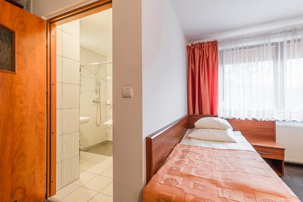 Postel nebo postele na pokoji v ubytování Wołosań B&B