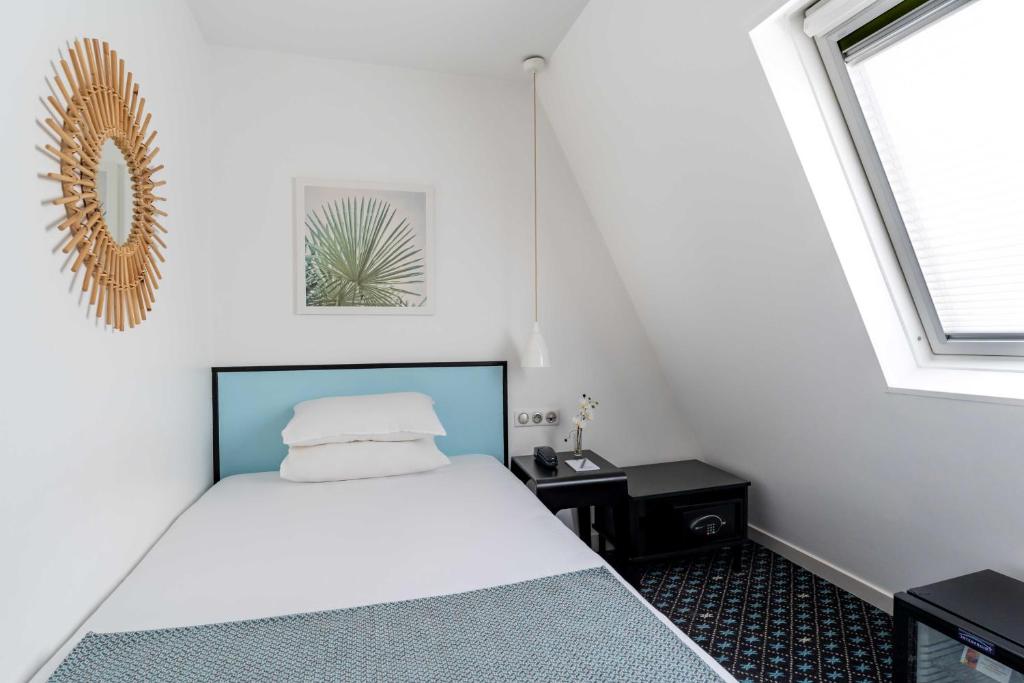 Ліжко або ліжка в номері Hotel Palm - Astotel