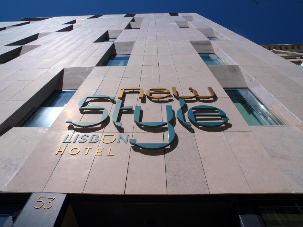 a hotel sign on the side of a building at New Style Lisbon Hotel in Lisbon
