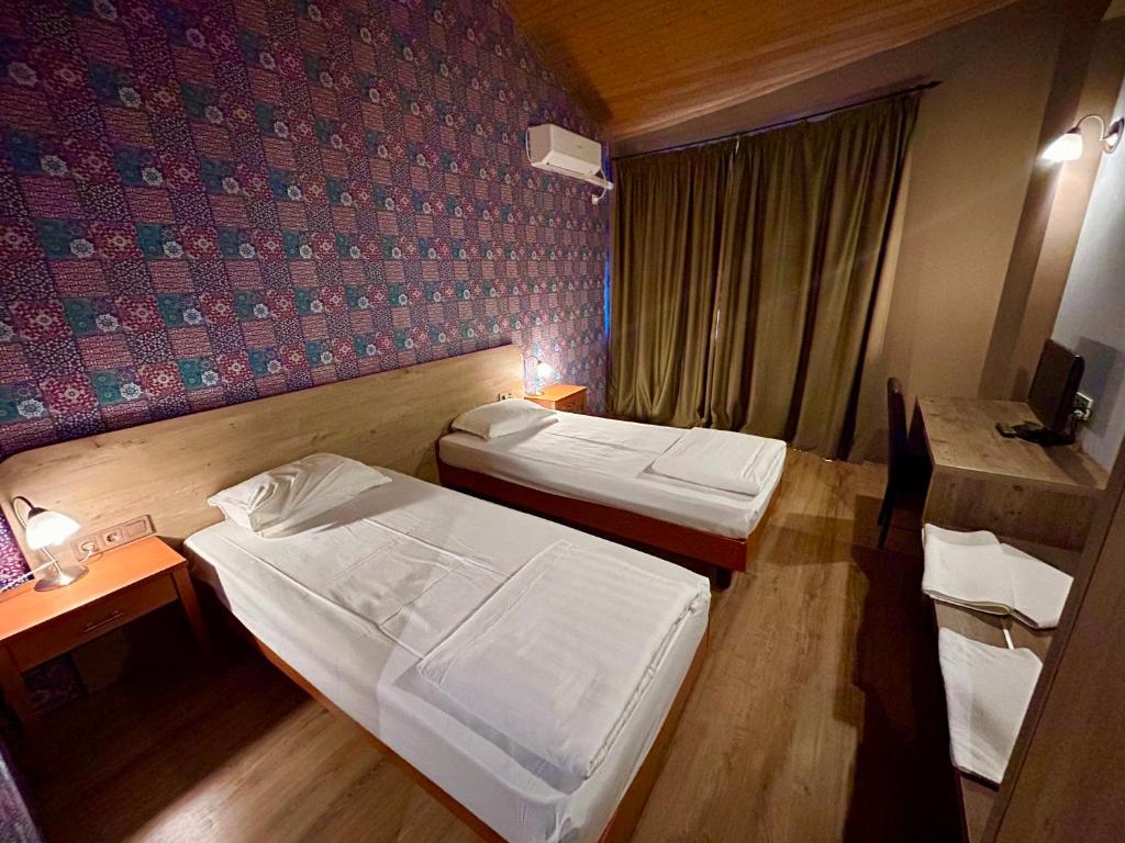 Postel nebo postele na pokoji v ubytování Dragoman Hotel
