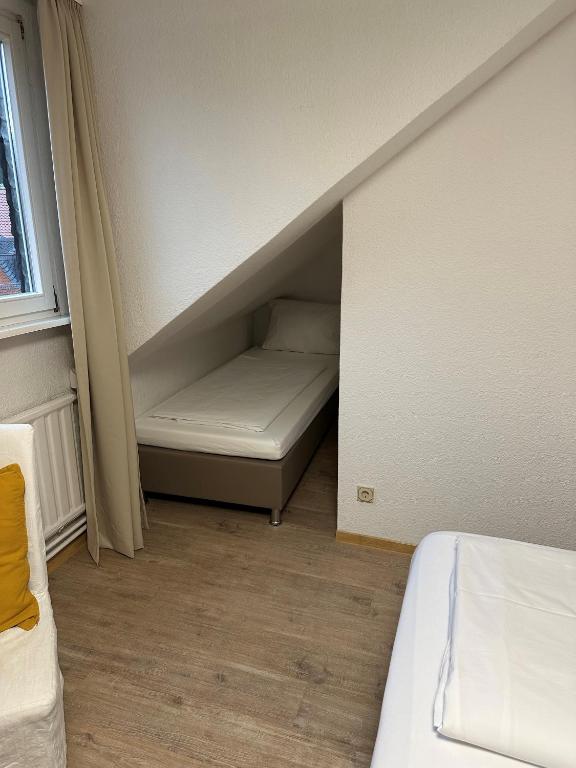 Postel nebo postele na pokoji v ubytování Hotel Goldenes Lamm