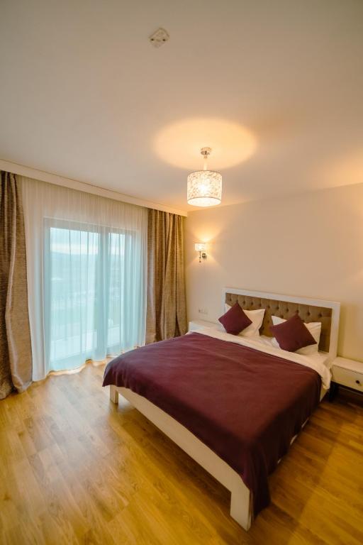 Postel nebo postele na pokoji v ubytování Crama Jelna Resort & Spa