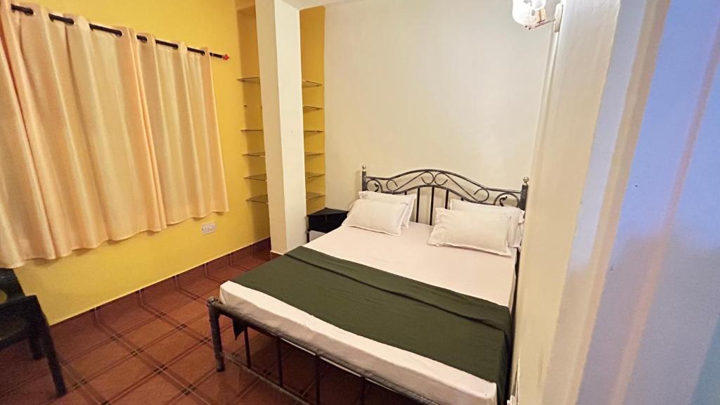 Postel nebo postele na pokoji v ubytování Muffys Guest House
