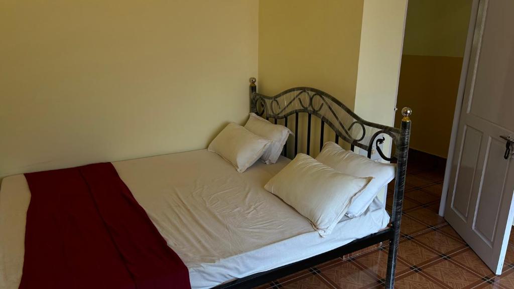 Postel nebo postele na pokoji v ubytování Muffys Guest House