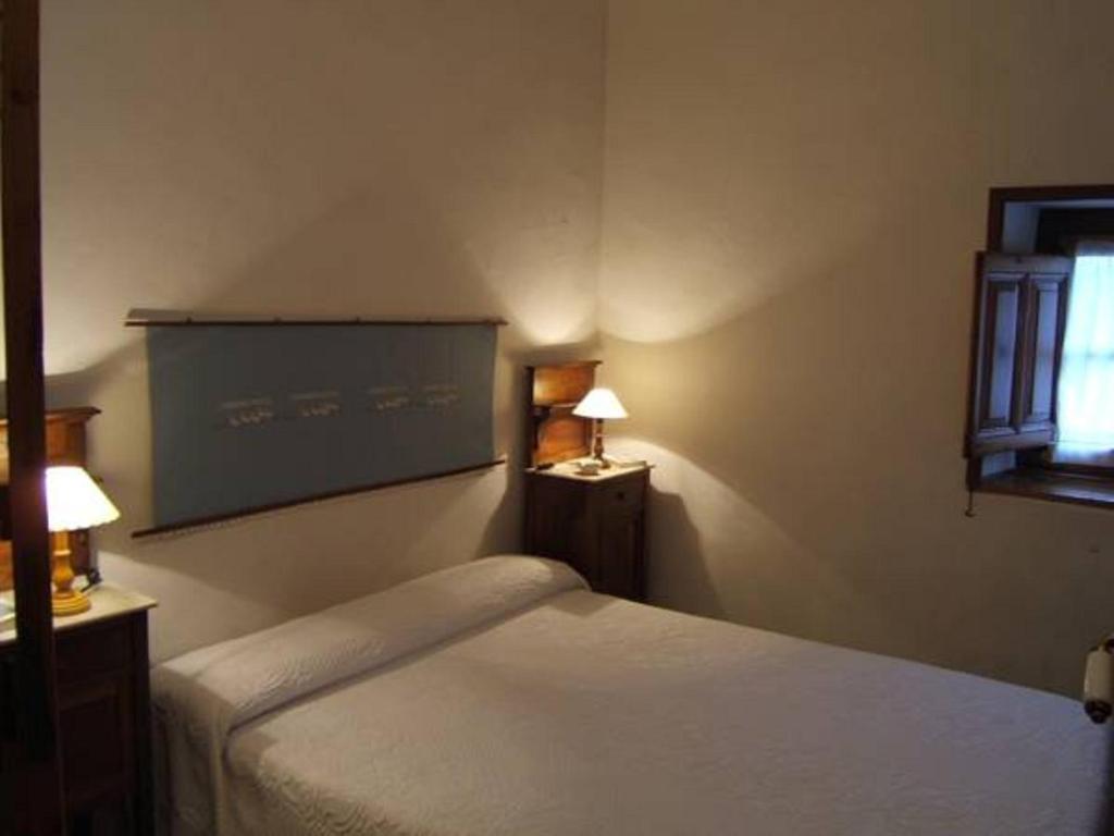 Postel nebo postele na pokoji v ubytování Finca el Palacio
