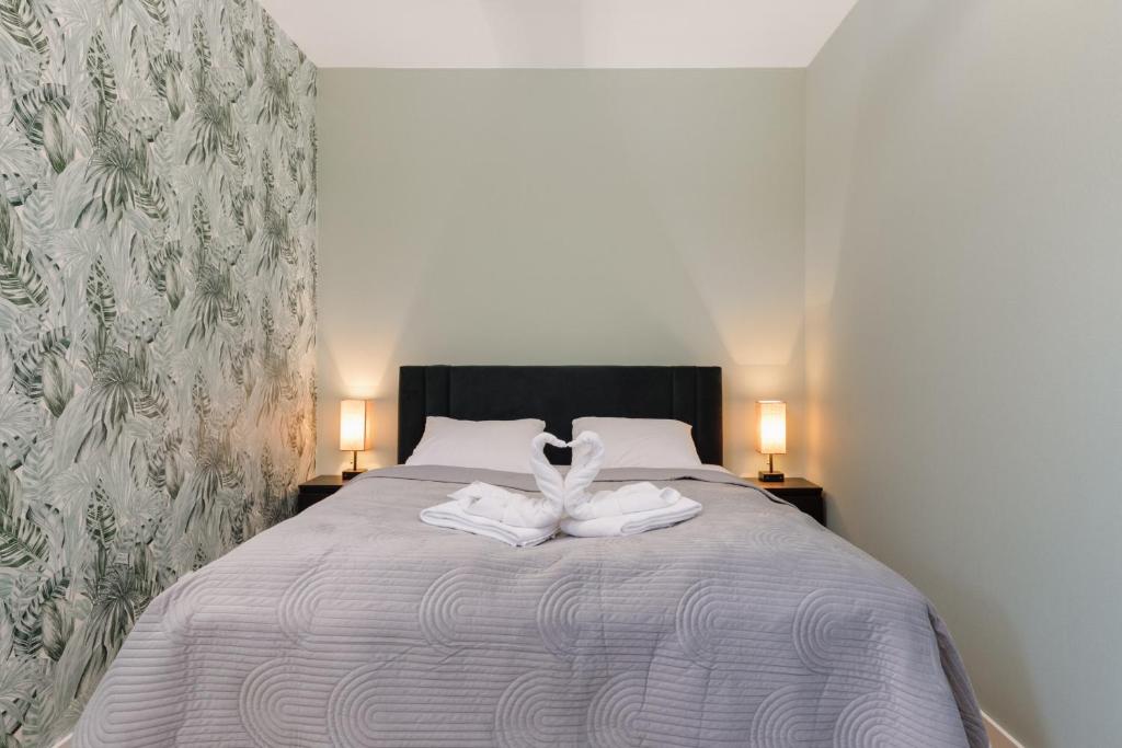Posteľ alebo postele v izbe v ubytovaní Green Square Apartments Świnoujście by Noclegi Renters