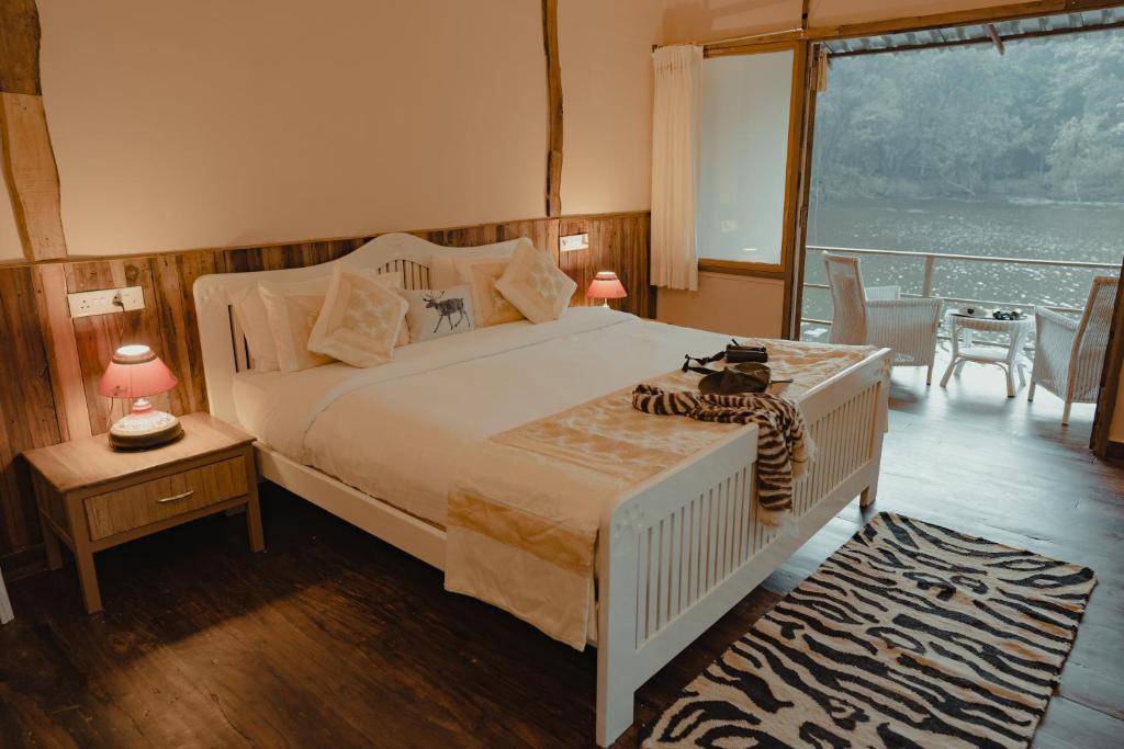 Postel nebo postele na pokoji v ubytování Rukhad Jungle Camp - Pench