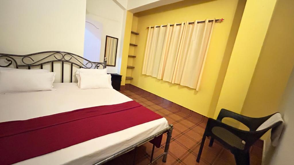 Postel nebo postele na pokoji v ubytování Muffys Guest House