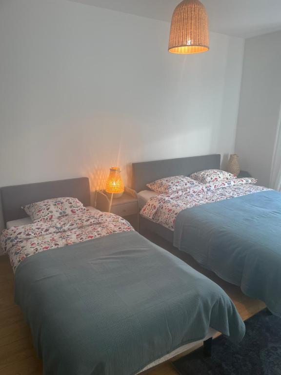 Posteľ alebo postele v izbe v ubytovaní Apartament Marta na Spokojnej