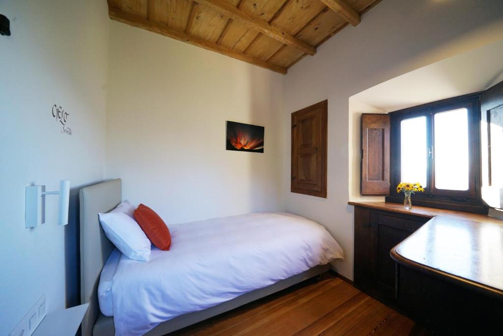 Postel nebo postele na pokoji v ubytování Ar Convént B&B