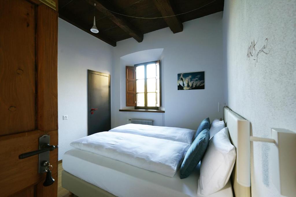 Postel nebo postele na pokoji v ubytování Ar Convént B&B