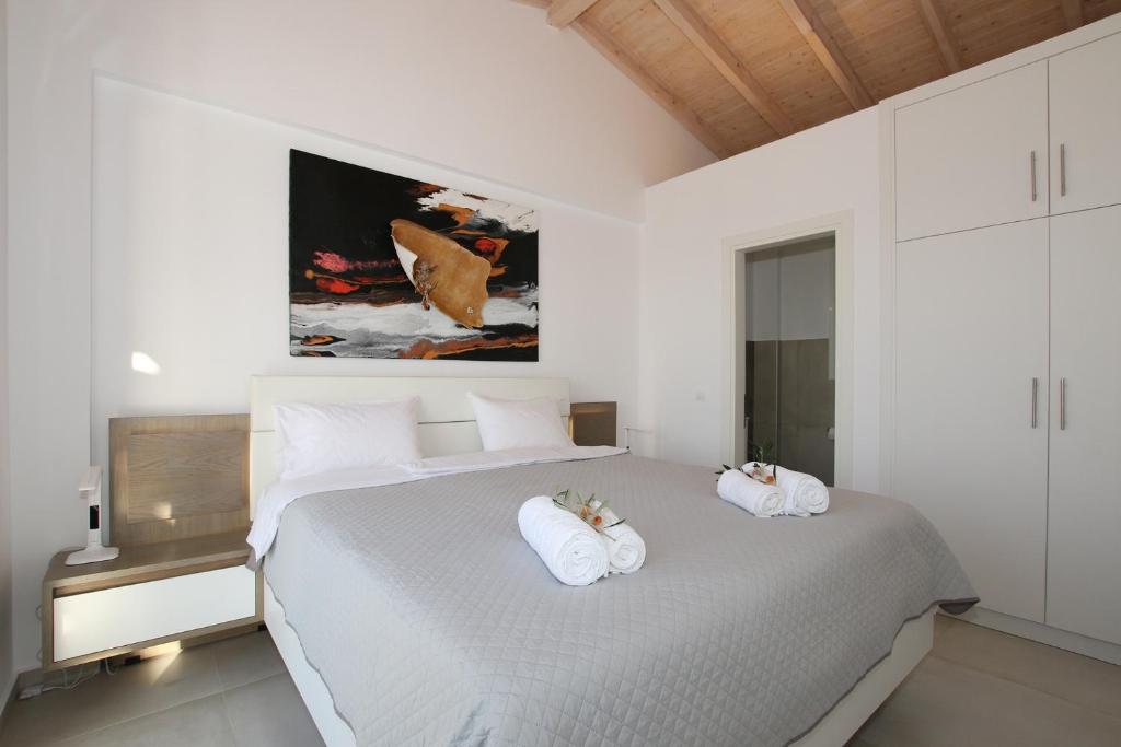 Postel nebo postele na pokoji v ubytování Sunset Sea View Villa 10