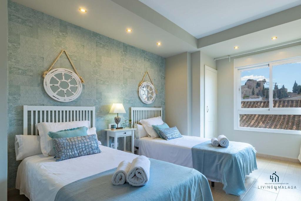 Posteľ alebo postele v izbe v ubytovaní Living4Malaga Picasso Deluxe Apartment
