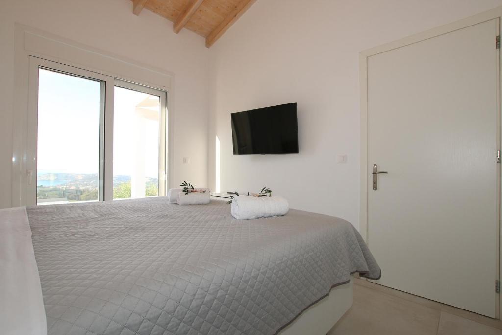 Postel nebo postele na pokoji v ubytování Sunset Sea View Villa 10