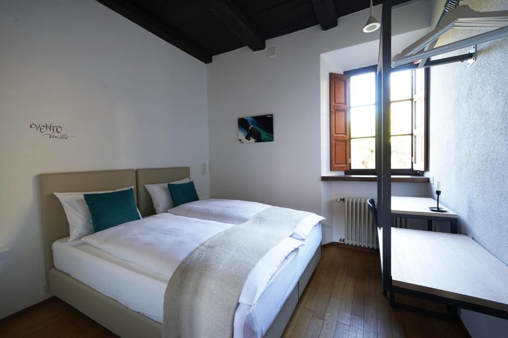 Postel nebo postele na pokoji v ubytování Ar Convént B&B