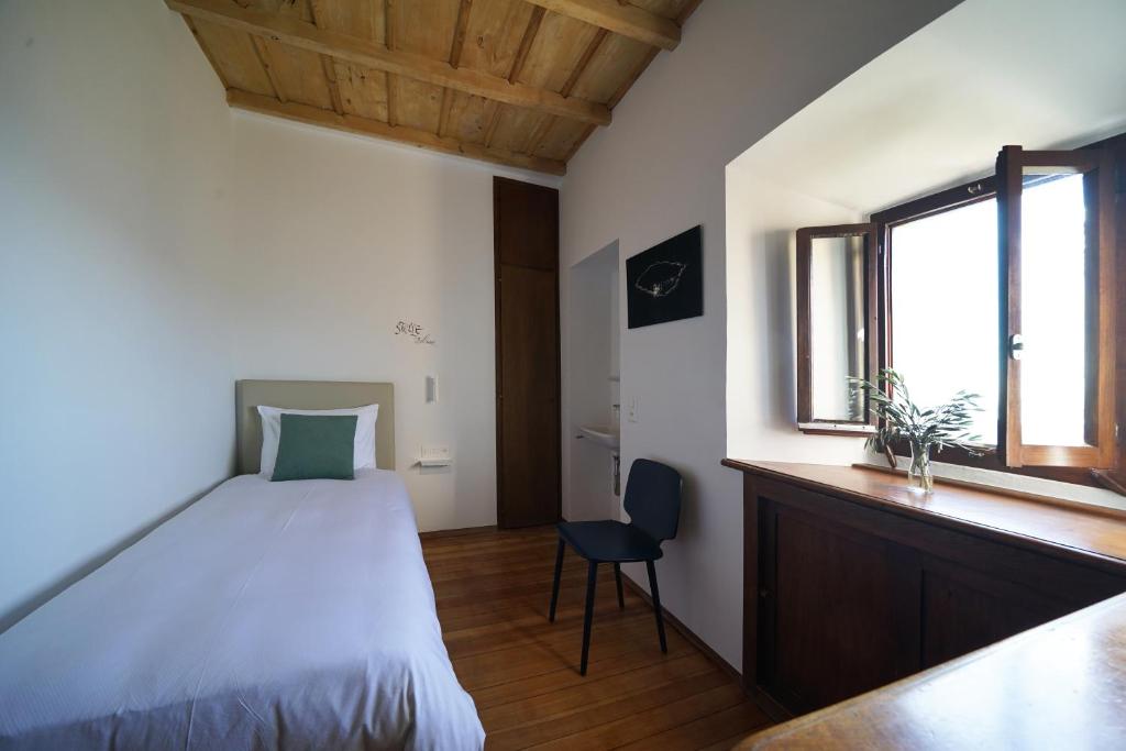 Postel nebo postele na pokoji v ubytování Ar Convént B&B