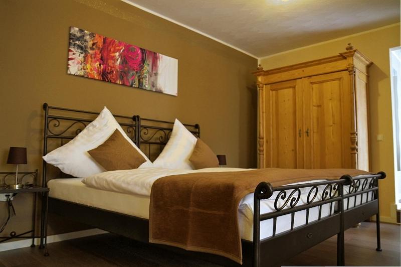 Postel nebo postele na pokoji v ubytování Apado-Hotel garni