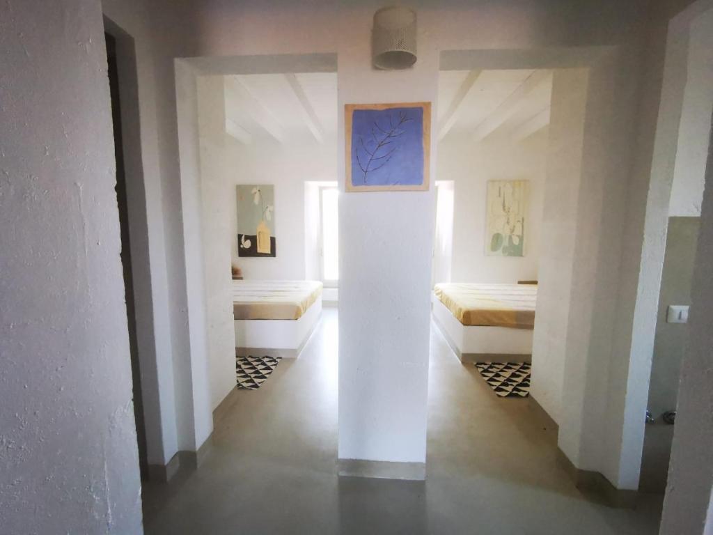 Postel nebo postele na pokoji v ubytování Masseria a libeccio