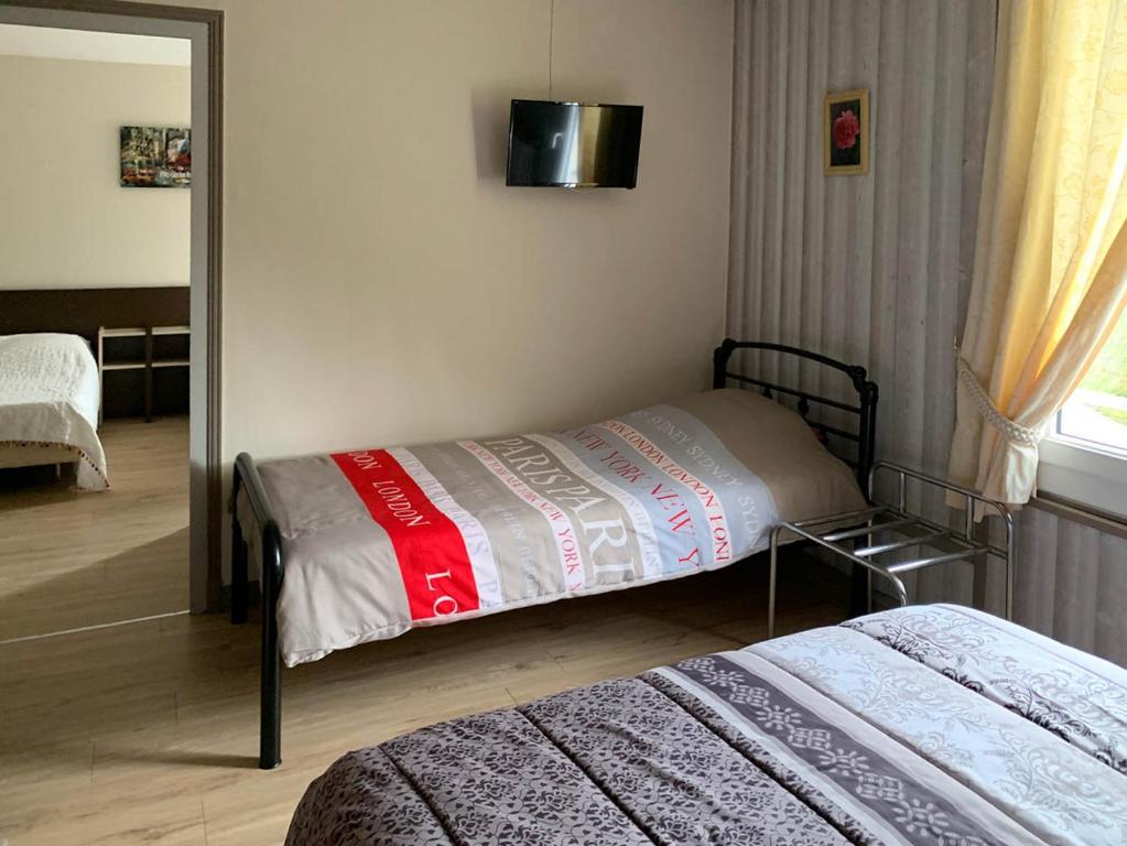 Postel nebo postele na pokoji v ubytování Hôtel l'Annexe