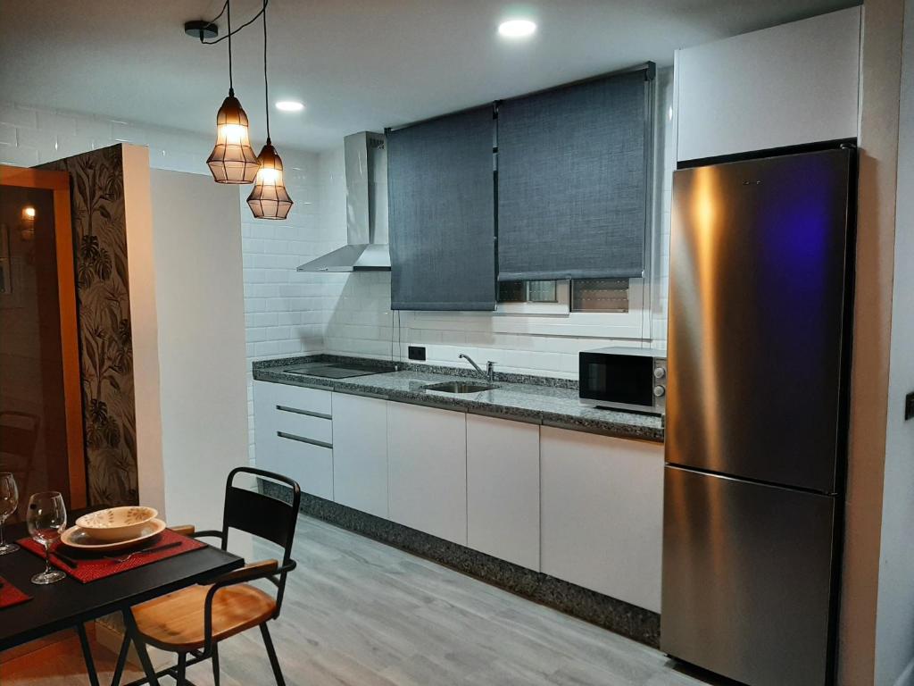 Kuchyň nebo kuchyňský kout v ubytování Apartamento Sierra Lof Paraiso