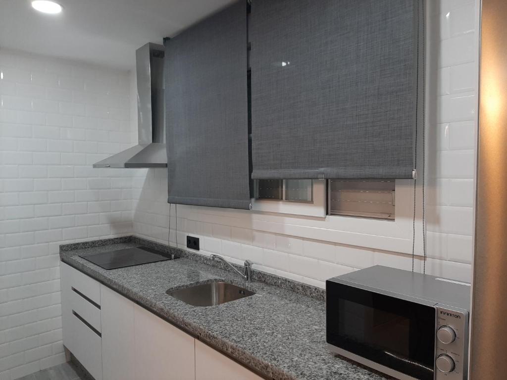 Kuchyň nebo kuchyňský kout v ubytování Apartamento Sierra Lof Paraiso