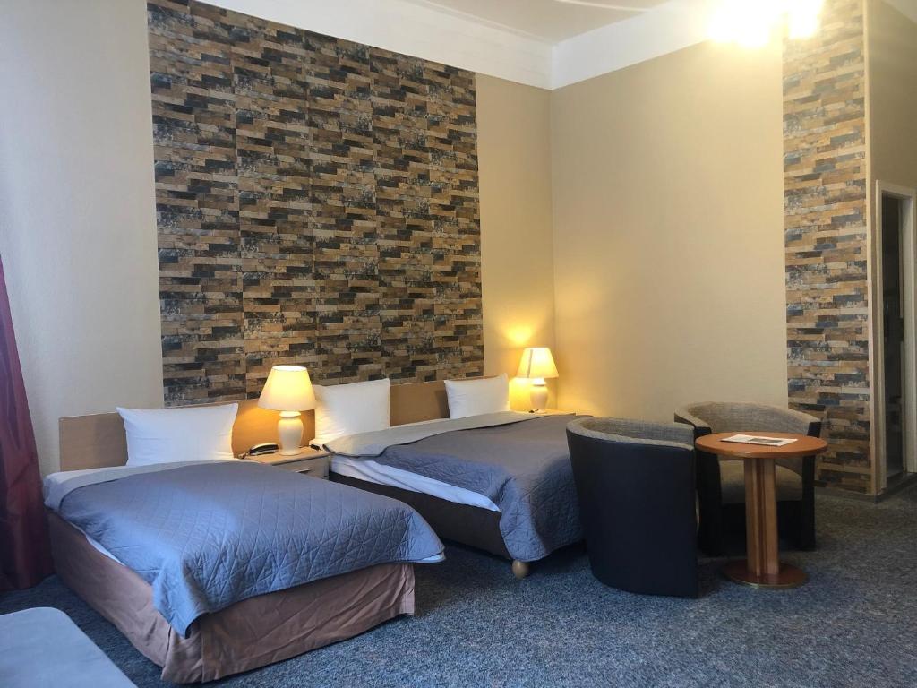 Postel nebo postele na pokoji v ubytování Hotel Castell am Kurfürstendamm