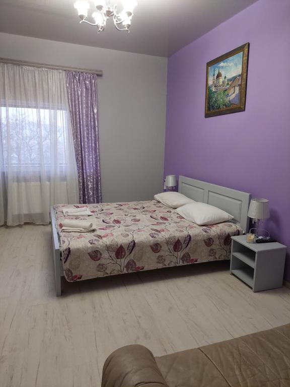 Postel nebo postele na pokoji v ubytování ЕЛІТ