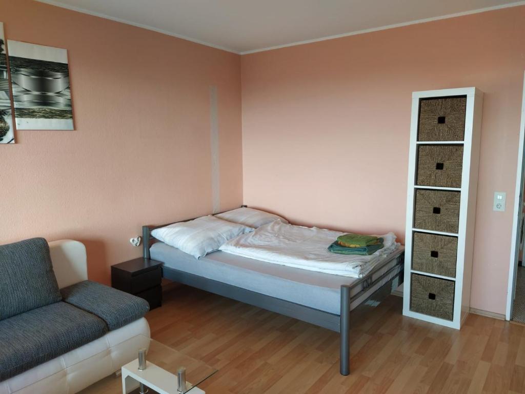 מיטה או מיטות בחדר ב-B1006, Schönes und gemütliches Appartement