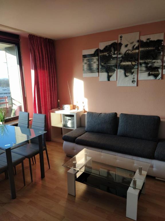 a living room with a couch and a table at B1006, Schönes und gemütliches Appartement in Lahnstein